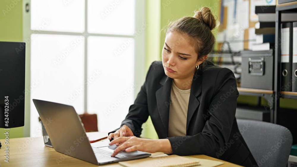 Young beautiful hispanic woman business worker using laptop working at office Young beautiful hispanic woman business worker using laptop working at office