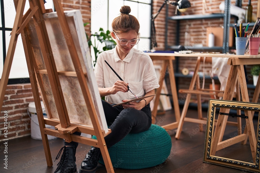 Young blonde woman artist smiling confident drawing at art studio