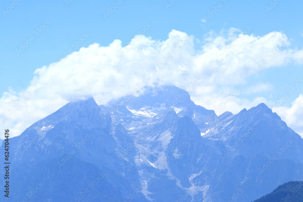 Triglav, Slovenian highest peak in Julian Alps, in summer clouds