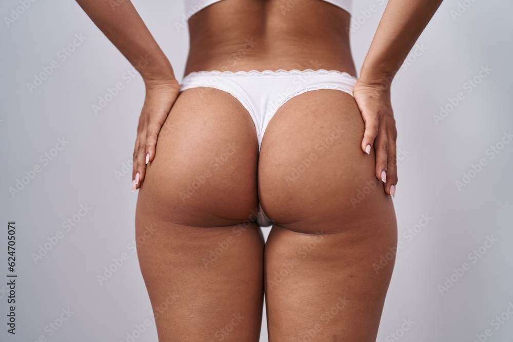 © Krakenimages.com - Young beautiful latin woman wearing lingerie standing over isolated white background