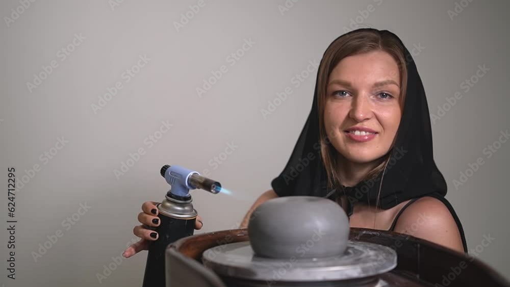 potter firing clay.woman working with clay. woman potter firing clay.High quality FullHD video
