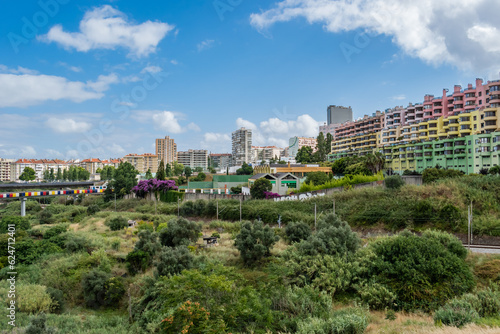 Colorful building in urban construction in Olaias with valley with trees and train line, Areeiro - Lisbon PORTUGAL