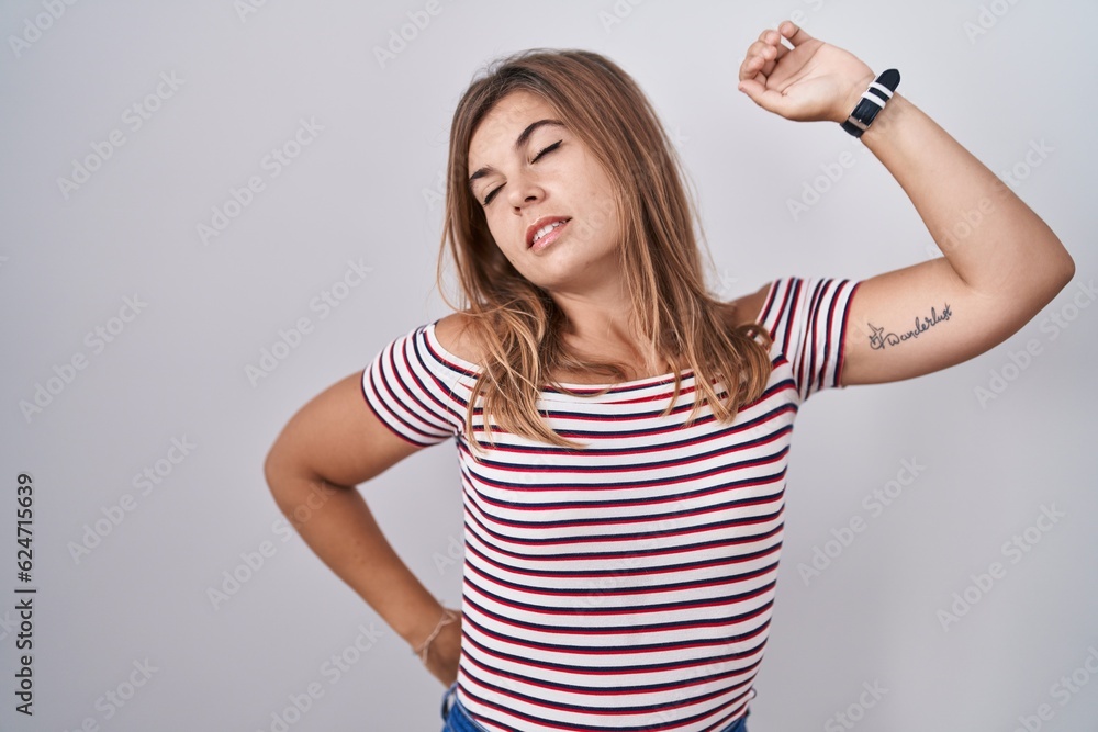 Young hispanic woman standing over isolated background stretching back, tired and relaxed, sleepy and yawning for early morning Young hispanic woman standing over isolated background stretching back, tired and relaxed, sleepy and yawning for early morning