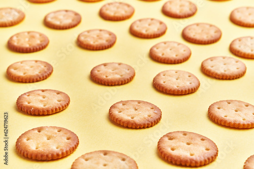  Delicious group of salty biscuits over isolated yellow background