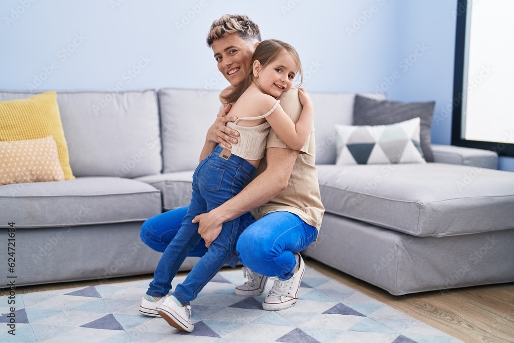 Father and daughter father and daughter hugging each other at home Father and daughter father and daughter hugging each other at home