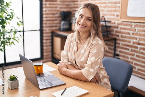 Young caucasian woman business worker using laptop working at office