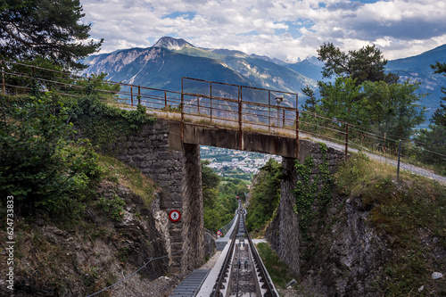 Landscape of Swiss Alps. Mountain  Sierre city  bridge and funicular trail in Switzerland. Crans Montana  Valais Canton  Switzerland.
