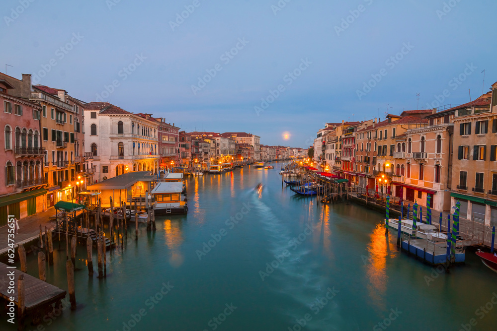 Panoramic view on famous Grand Canal among historic houses in Venice, Italy at sunny day