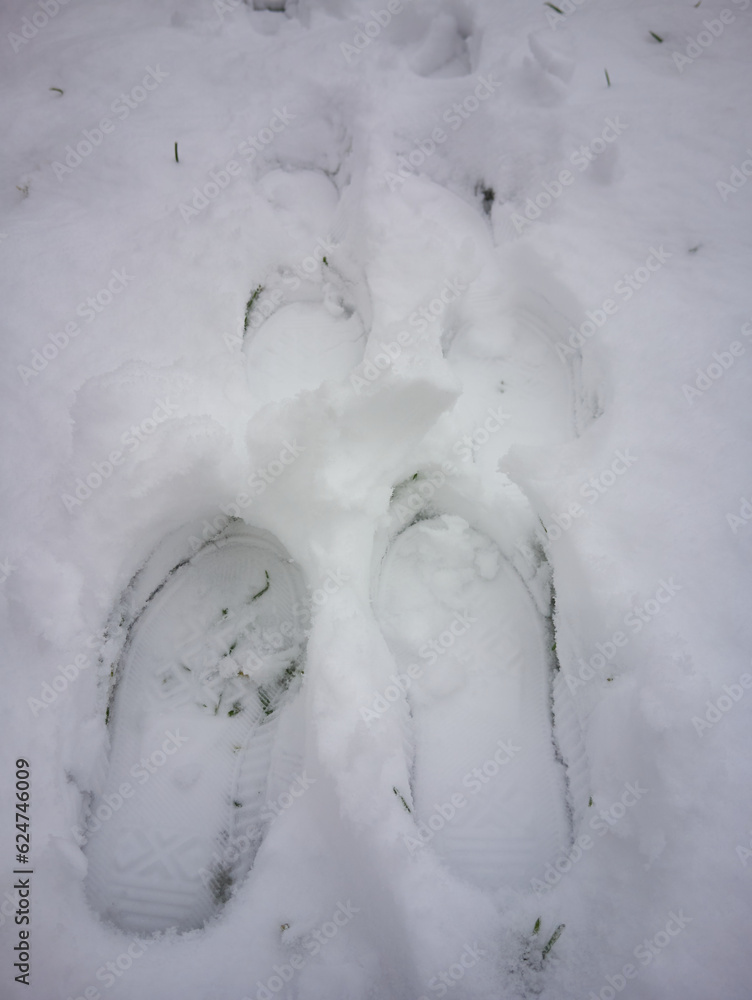 boot marks in the snow,in winter, traces of children's boots on the snow boot marks in the snow,in winter, traces of children's boots on the snow