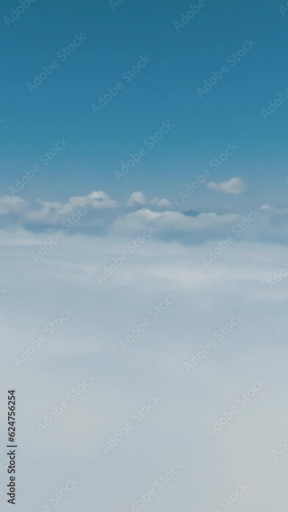 View of clouds over the mountains. Clouds over the mountains. Aerial vertical background, vertical video background, vertical video. View of clouds over the mountains. Clouds over the mountains. Aerial vertical background, vertical video background, vertical video.