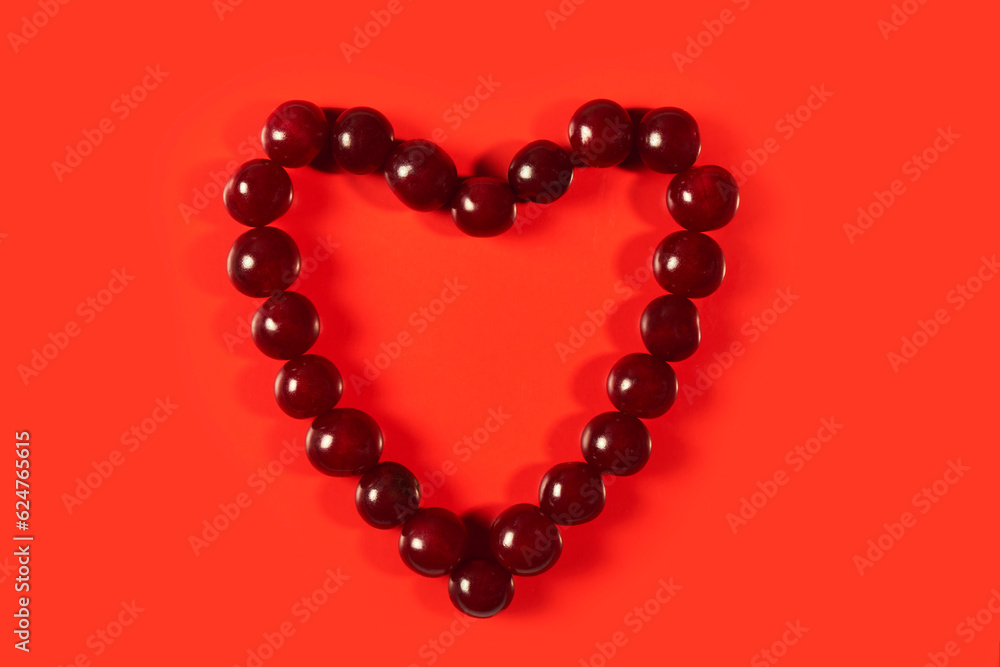 ruby cherry heart on a red background, a symbol of love and passion ruby cherry heart on a red background, a symbol of love and passion