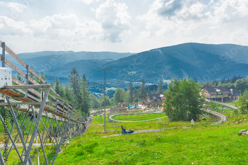Fotografie Summer toboggan run on the Równica mountain overlooking Ustroń in the Silesian Beskids (Poland)