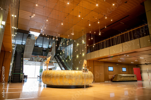 Obraz na plátne modern hotel interior with round reception desk and sophisticated lobby design,