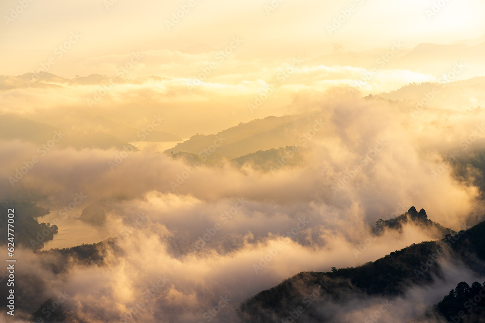 Beautiful sea of mist with the mountains during sunrise time at Aiyeweng view point located in Yala province south Thailand