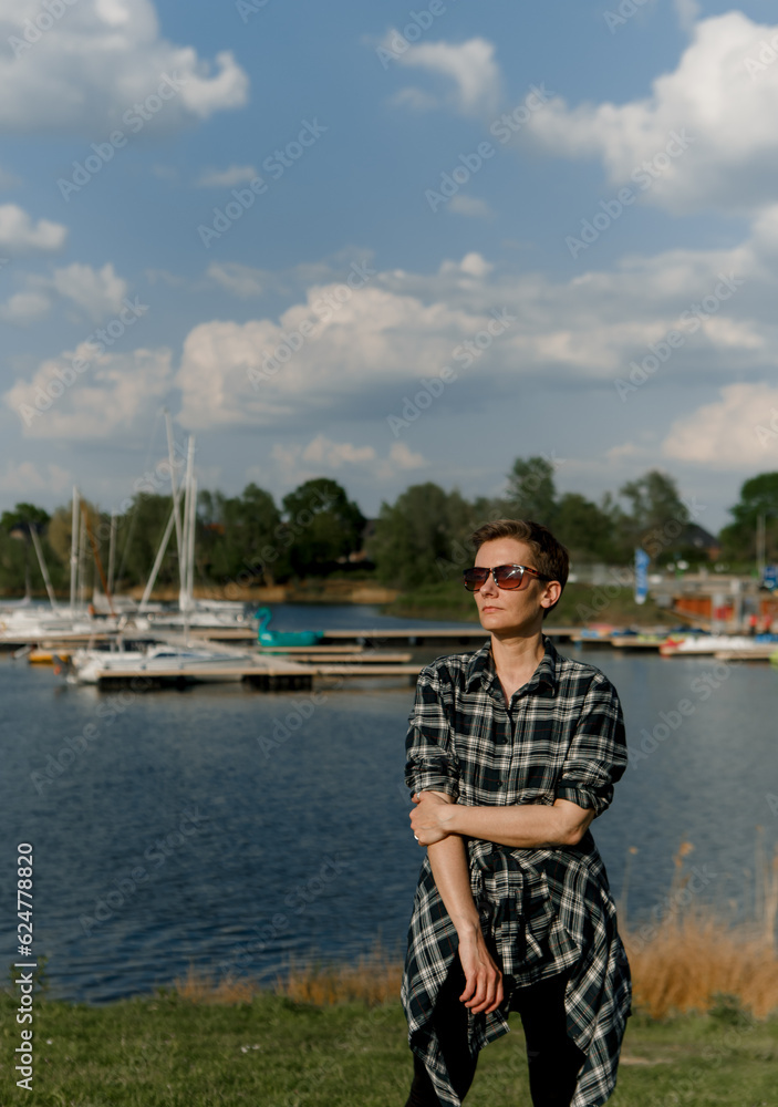 woman tourist travel shore background lake yachts
