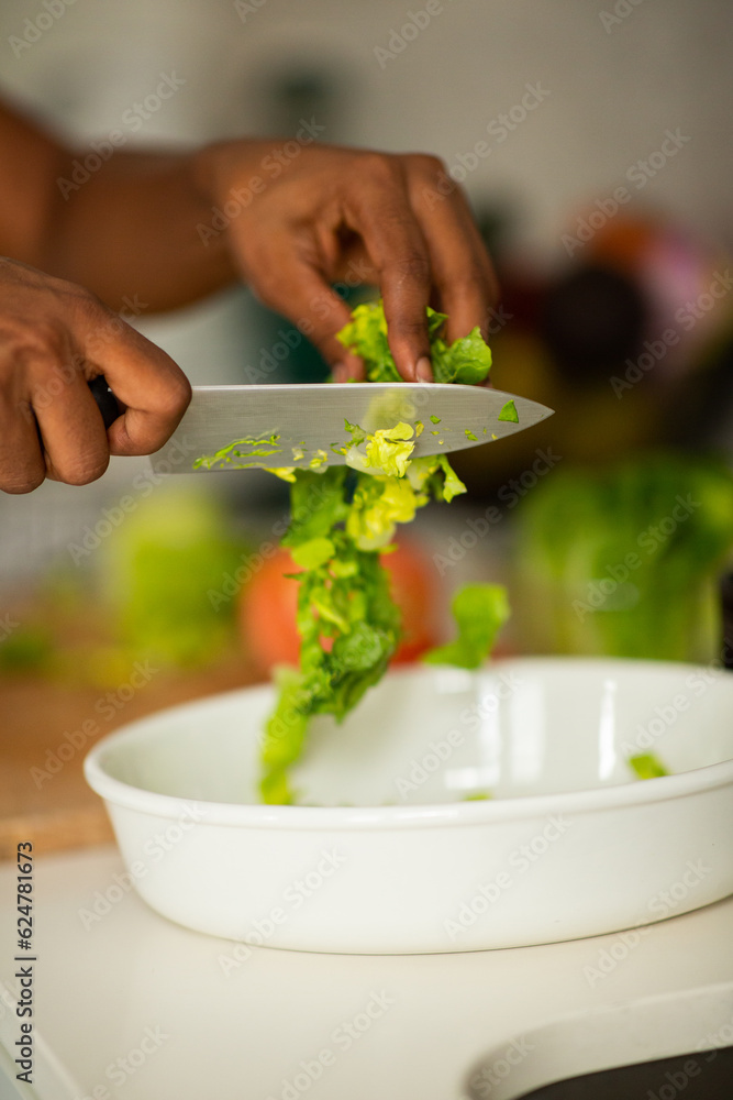 woman hands using knife to cut vegetables woman hands using knife to cut vegetables