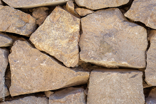 ancient stone blocks wall close up abstract texture background photo