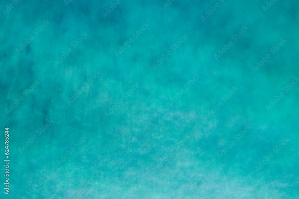 Aerial view of a clear sea water texture. View from above Natural turquoise background, green water reflection.