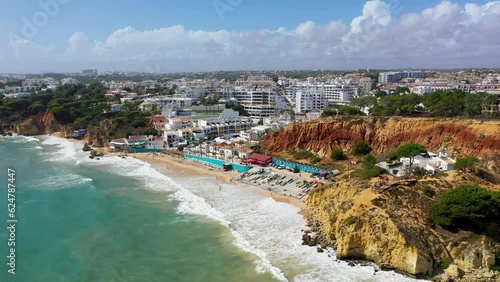 Amazing view from the sky of town Olhos de Agua in Albufeira, Algarve, Portugal. Aerial coastal view of town Olhos de Agua, Albufeira area, Algarve, Portugal. photo