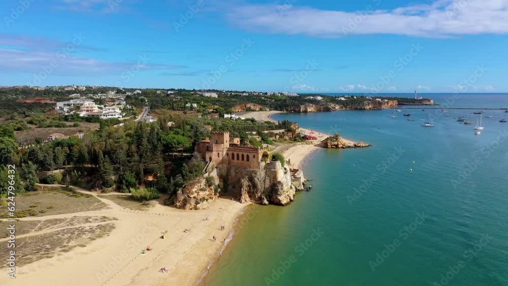 The Fort of Sao Joao do Arade (Castle of Arade) in Ferragudo Village, Algarve. Beach and castle Sao Joao do Arade in Ferragudo in the Algarve in Portugal. The Fort of Sao Joao do Arade (Castle of Arade) in Ferragudo Village, Algarve. Beach and castle Sao Joao do Arade in Ferragudo in the Algarve in Portugal.
