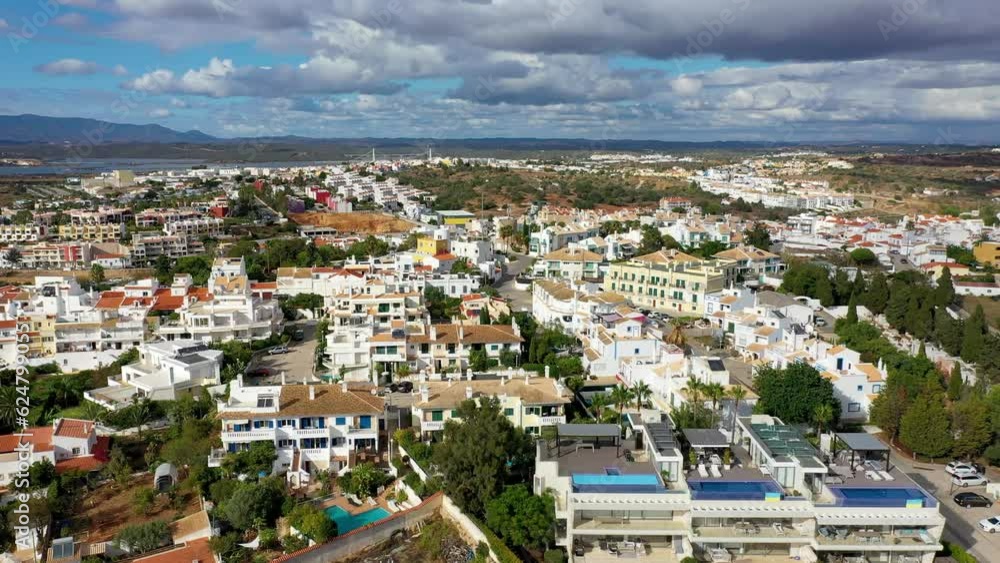 View of Ferragudo village in Algarve, Portugal. Old sea town of Ferragudo. View of Ferragudo from the air. Ferragudo is a beautiful coastal village in Algarve, Portugal, Europe. View of Ferragudo village in Algarve, Portugal. Old sea town of Ferragudo. View of Ferragudo from the air. Ferragudo is a beautiful coastal village in Algarve, Portugal, Europe.