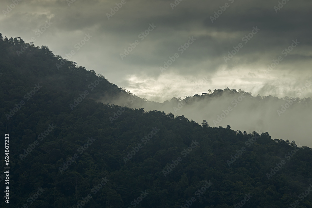 Beautiful sunshine at misty morning mountains