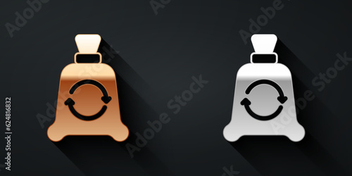 Gold and silver Garbage bag with recycle symbol icon isolated on black background. Trash can icon. Recycle basket sign. Long shadow style. Vector
