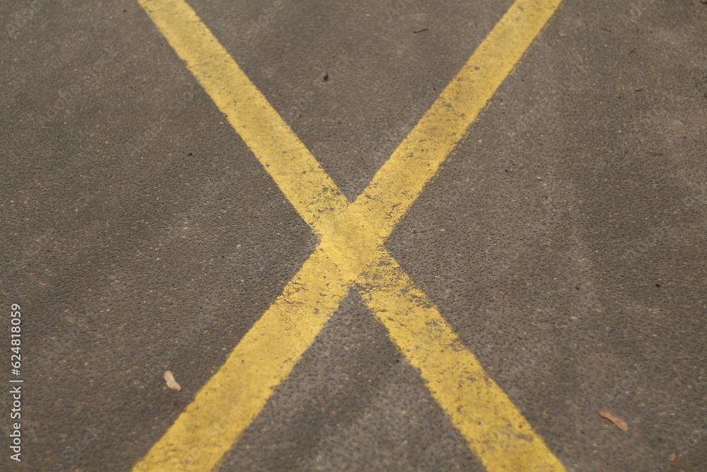 Fototapeta premium yellow lines on asphalt