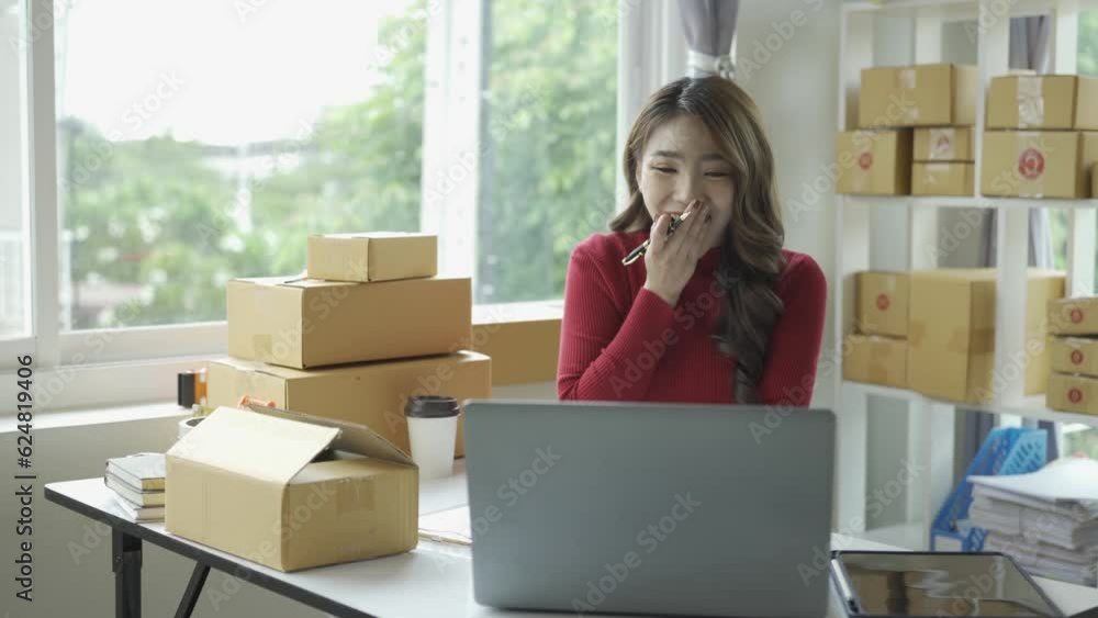 Happy successful asian businesswoman excited to receive purchase order and check stock Working at home office with parcel box laptop small business owner Online marketing, SME business concept Happy successful asian businesswoman excited to receive purchase order and check stock Working at home office with parcel box laptop small business owner Online marketing, SME business concept