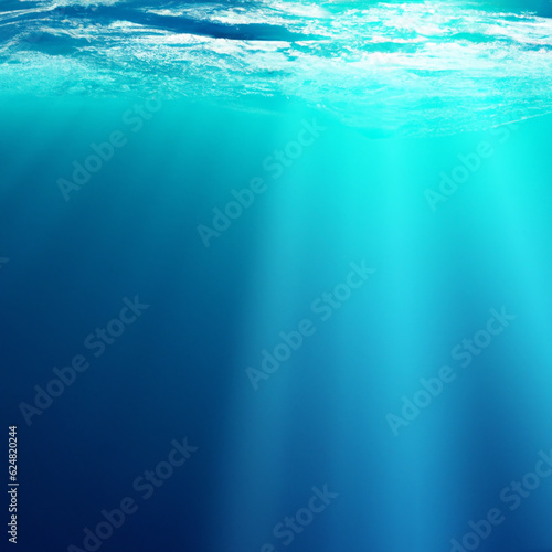 Beautiful blue ocean surface seen from underwater with rays of sunlight shining through. Abstract Fractal waves underwater
