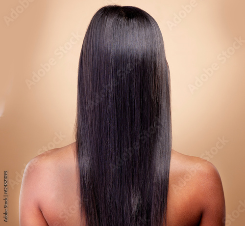Back view, hair and woman, beauty and shine with cosmetic care isolated on brown studio background. Female model, haircare and growth, cosmetology and texture with growth and salon hairstyle glow