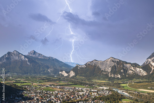 Panorama of the city of Bad Ragaz against the background of the Swiss Alps at sunset with lightning strike. Bad Ragaz Switzerland. Aerial view. Top view. photo