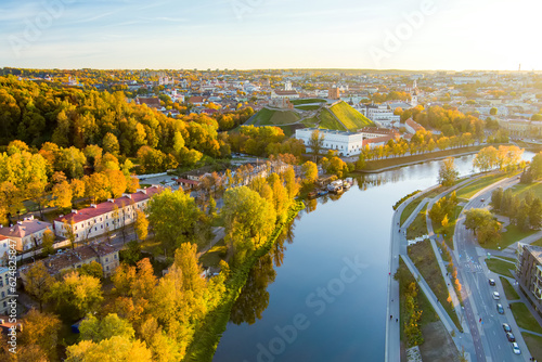 Fototapeta Naklejka Na Ścianę i Meble -  Beautiful Vilnius city panorama in autumn with orange and yellow foliage. Aerial evening view.