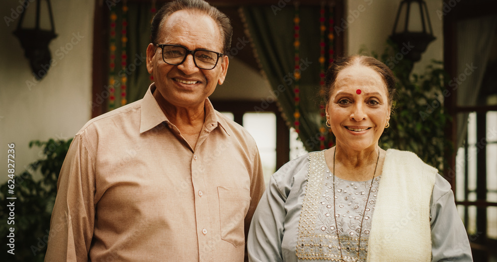 Portrait of Happy Indian Elderly Couple Posing Together at Their Authentic Mumbai Home. Senior Husband and Wife Celebrating Shared Years of Love and Appreciation, Looking at the Camera Portrait of Happy Indian Elderly Couple Posing Together at Their Authentic Mumbai Home. Senior Husband and Wife Celebrating Shared Years of Love and Appreciation, Looking at the Camera