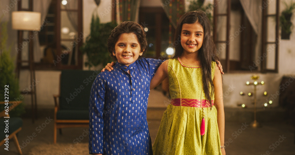 Portrait of Two Little Cute Kids Posing and Hugging Together at Home. Brother and Sisters in Traditional Indian Clothes Happily Looking at the Camera, Enjoying Childhood, Hopeful about the Future