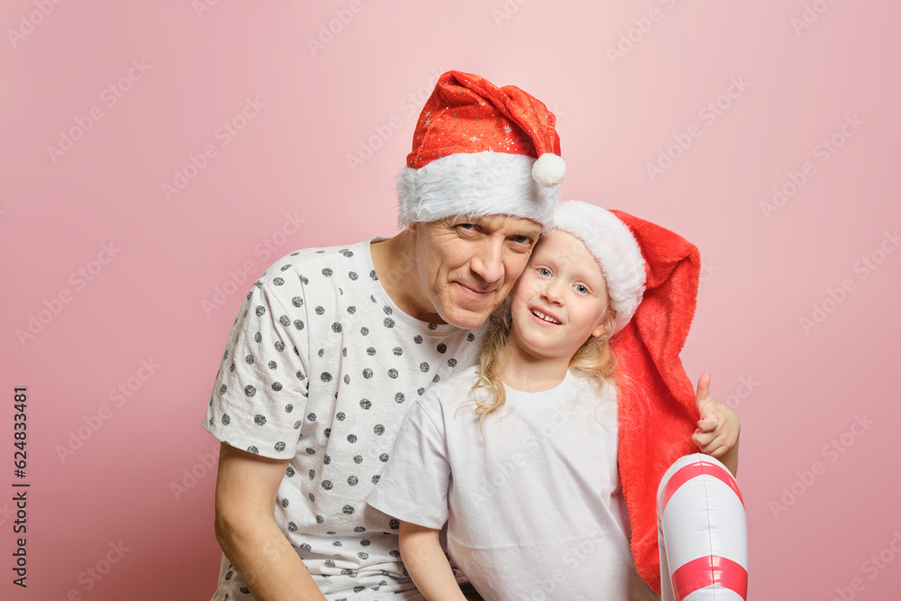 grandpa and granddaughter have fun on the eve of christmas grandpa and granddaughter have fun on the eve of christmas