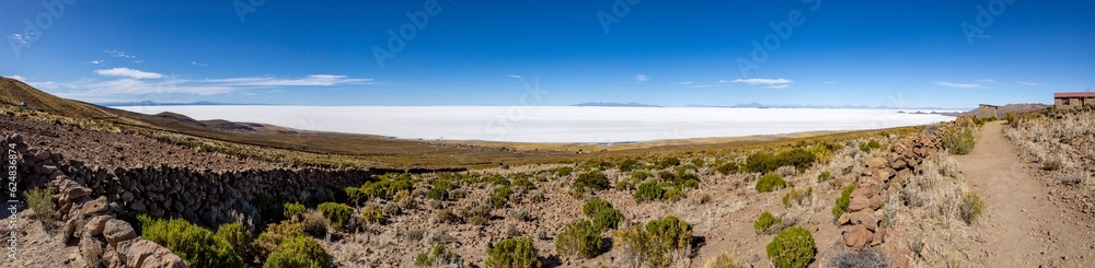 Panorama of the famous Salar de Uyuni, the biggest salt flats in the world, viewed from a mountain on the edge of the lake - natural sight in Bolivia