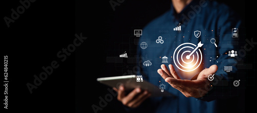 Fototapeta Naklejka Na Ścianę i Meble -  Businessman or Analyst working with Business Analytics and Data Management System on virtual screen,Corporate strategy for finance, operations, sales, marketing.