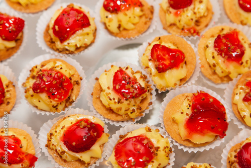 sweet with cream and strawberry, aperitifs and snacks for parties.