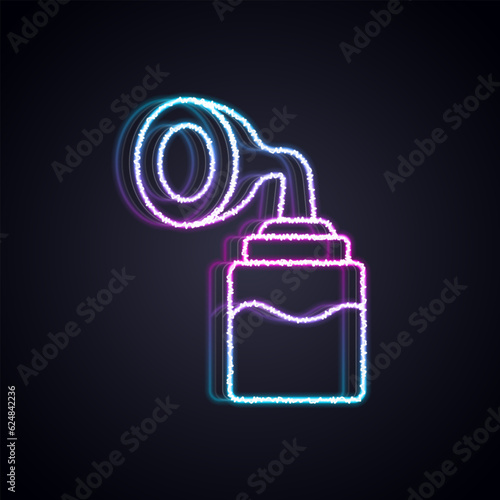 Glowing neon line Breast pump icon isolated on black background. Vector
