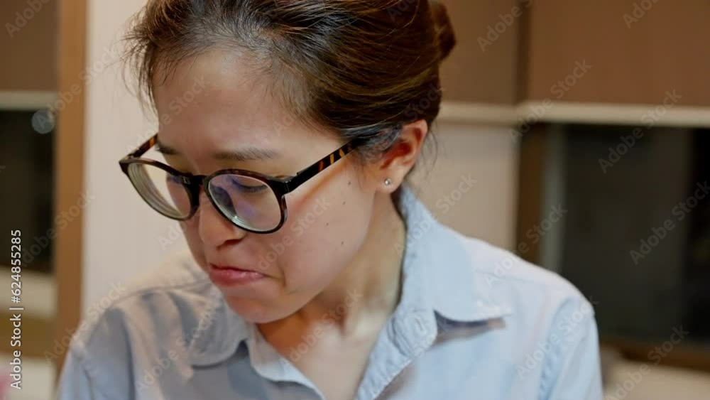 a young Asian person wears a sad expression. Their eyes convey a depth of emotion, hinting at inner reflections and unseen struggles. A glimpse into the complexities of human emotions . a young Asian person wears a sad expression. Their eyes convey a depth of emotion, hinting at inner reflections and unseen struggles. A glimpse into the complexities of human emotions .