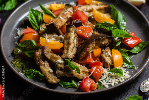 Warm eggplant, pepper, tomato and basil salad