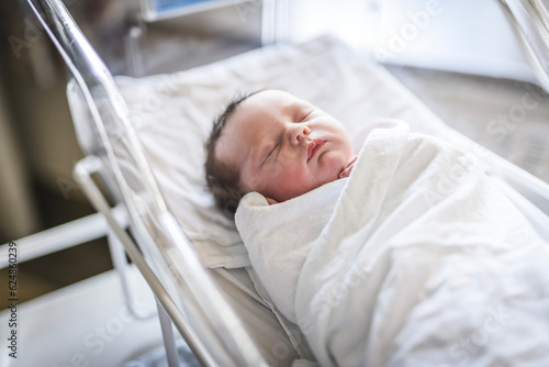 Adorable Caucasian Newborn Child Lying in Hospital Bed