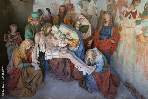 VARALLO, ITALY - JULY 17, 2022: The sculptural group of Pieta (Deposition) in the chapel of church Basilica del Sacro Monte by Giovanni D’Enrico (1638-1640).
