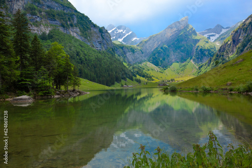 Picturesque Seealpsee, an idyllic alpine lake in the Alpstein range of the canton of Appenzell Innerrhoden, Switzerland. 