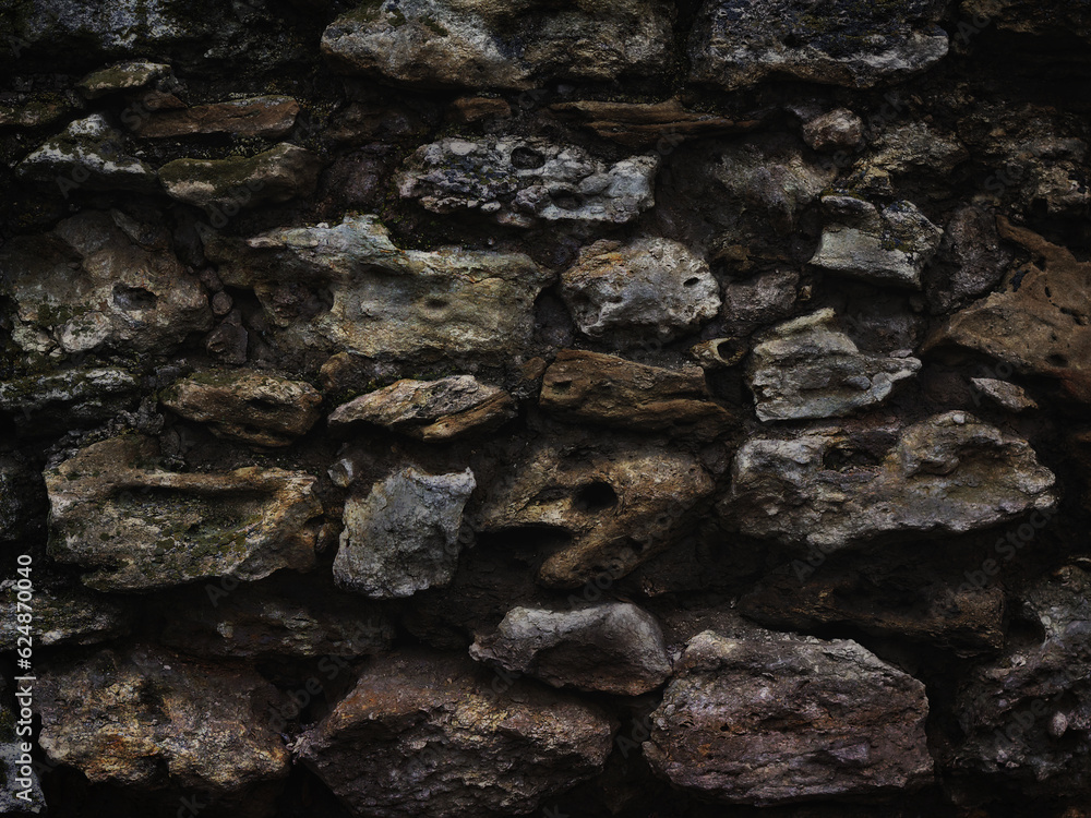 old wall of rough stones as dark vintage background