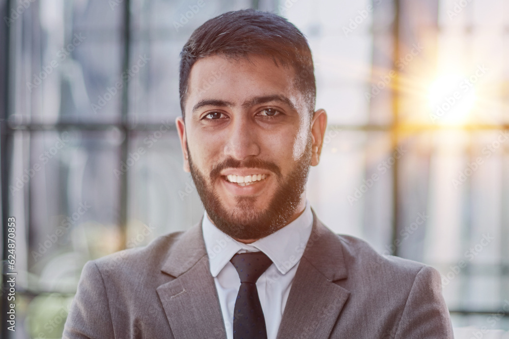 Portrait of successful young businessman in office Portrait of successful young businessman in office