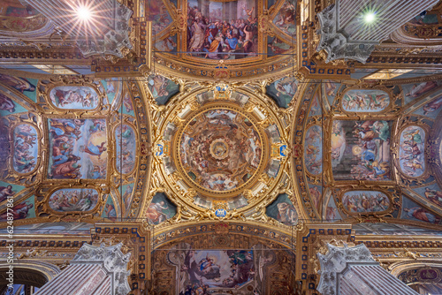 GENOVA, ITALY - MARCH 6, 2023: The Assumption in cupola of the church Basilica della Santissima Annunziata del Vastato by Andrea Ansaldo (1584–1638). photo
