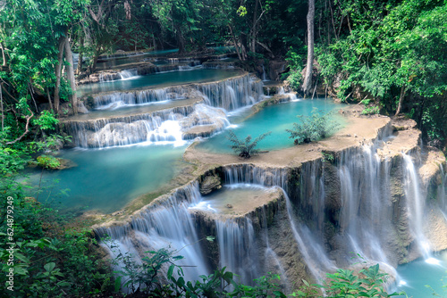 Beautiful nature Huai Mae Khamin waterfall in summer season, cataract falls in green rainforest, the large natural water resources in tropical jungle of Kanchanaburi province, Thailand.