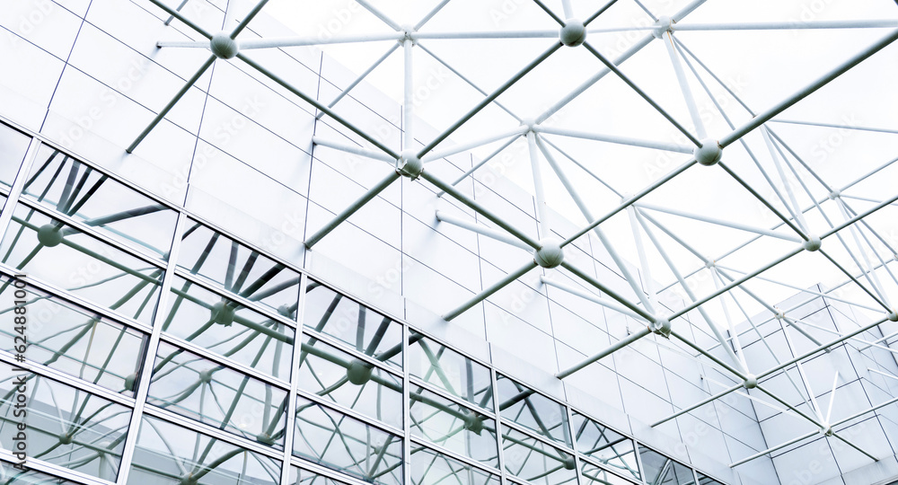 Low angle view of modern glass office building interior